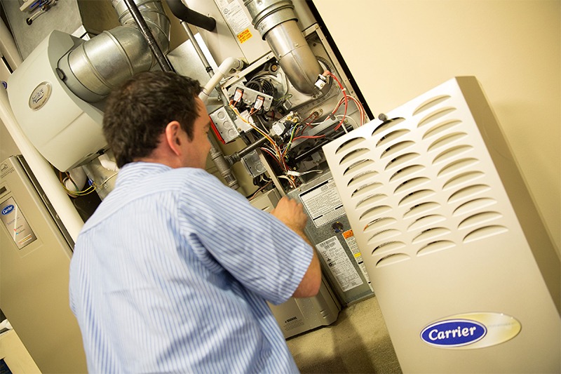 Air Group Tech Doing Maintenance on Heating Furnace Air Group Tech