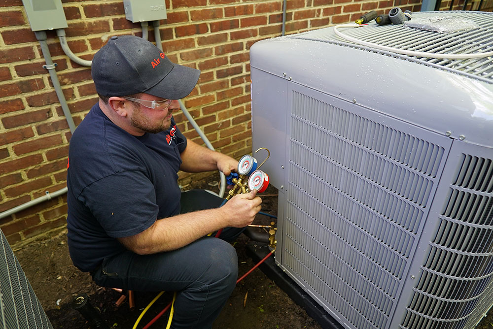 Air Group Tech Doing Maintenance on Condenser Air Group Tech